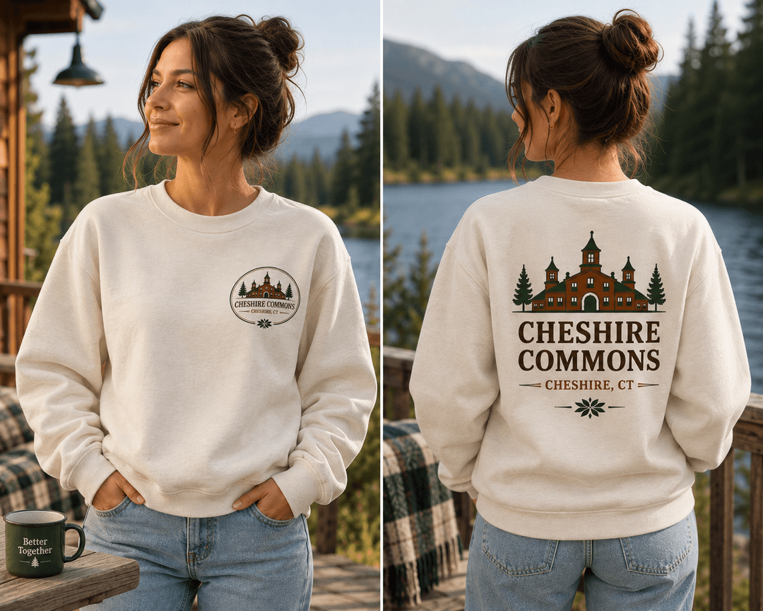 Model wearing an ivory crewneck sweatshirt with a Cheshire Commons crest and full back print