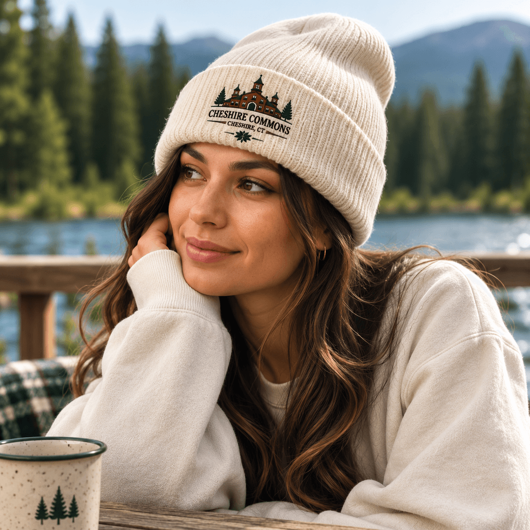 Ivory cuffed beanie embroidered with the Cheshire Commons crest