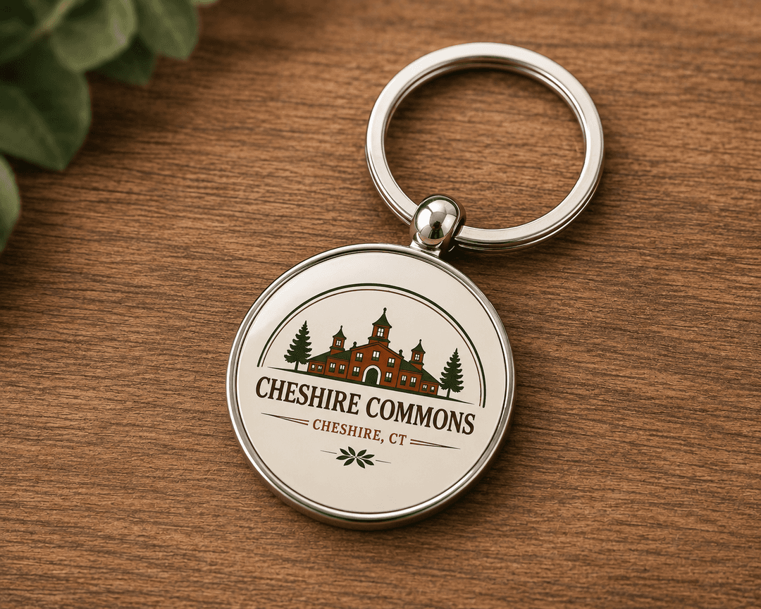 Oval enamel keychain with the Cheshire Commons crest