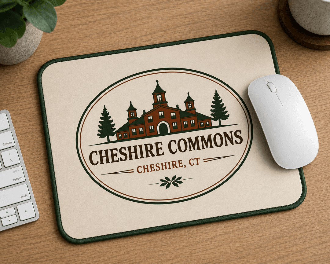 Cream mouse pad with the oval Cheshire Commons crest