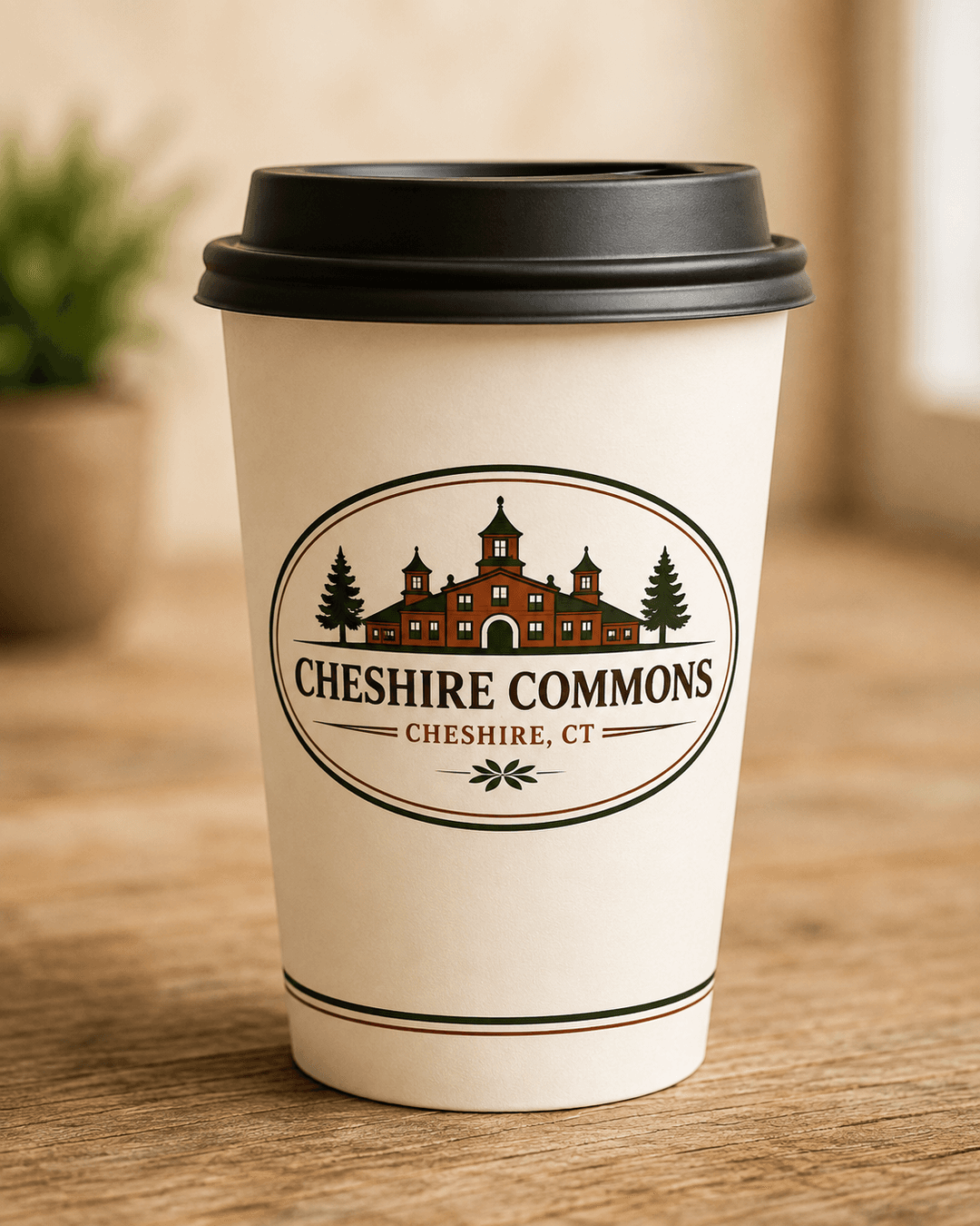 Insulated paper-style to-go cup with a Cheshire Commons crest and lid